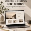 Un ordinateur portable affichant un design de site web chic pour coachs d'affaires avec des tons doux et un fond noir.